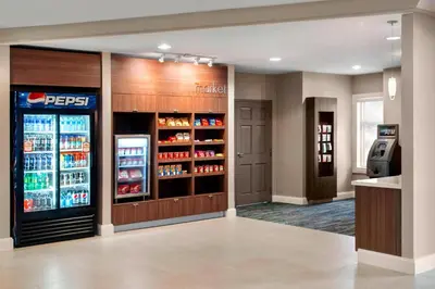 a drink station in a restaurant with a refrigerator at Residence Inn by Marriott Newark Elizabeth/Liberty International Airport in Elizabeth
