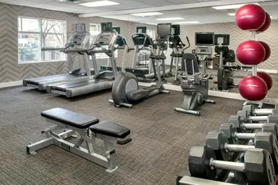 a fitness room with treadmills and cardio machines at Residence Inn by Marriott Newark Elizabeth/Liberty International Airport in Elizabeth