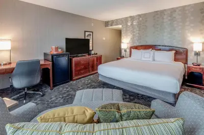 a hotel room with a bed and a desk at Courtyard by Marriot Cranbury South Brunswick in Cranbury