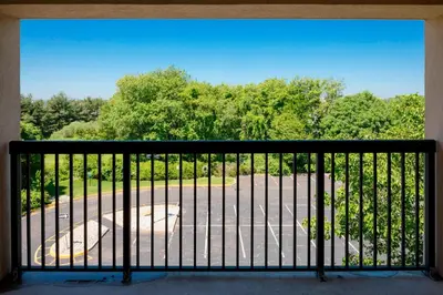 a balcony with a view of a parking lot at Courtyard by Marriot Cranbury South Brunswick in Cranbury