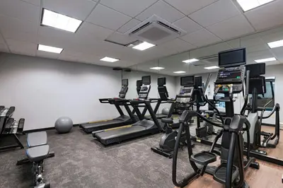 a gym with treadmills and elliptical machines at Fairfield Inn & Suites by Marriott Edison - South Plainfield in Edison