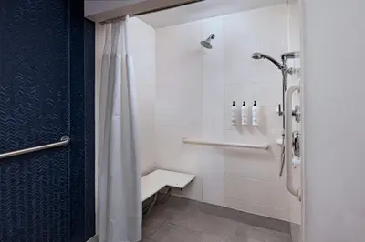 a bathroom with a shower with a shower curtain at Fairfield Inn & Suites by Marriott Edison - South Plainfield in Edison
