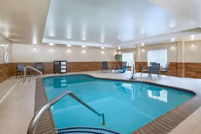 a large swimming pool in a hotel room at Fairfield Inn & Suites by Marriott Edison - South Plainfield in Edison