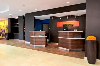 a lobby of a store with counters and flowers at Courtyard Rockaway-Mount Arlington in Mount Arlington