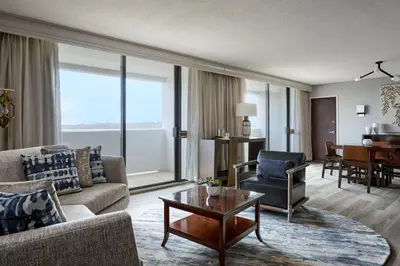 a living room with a couch and a table at Hanover Marriott in Whippany
