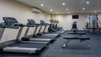 a gym with a row of treadms and machines at Fairfield Inn & Suites Parsippany in Parsippany