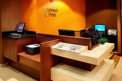 an office with a counter with two computers on it at Fairfield Inn & Suites Parsippany in Parsippany
