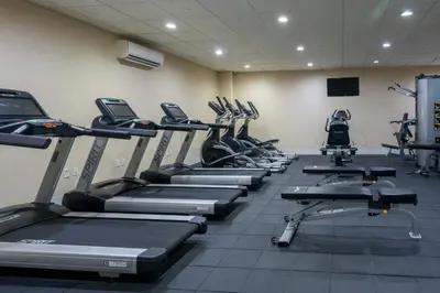 a gym with a row of treadms and machines at Fairfield Inn & Suites Parsippany in Parsippany