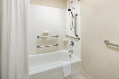 a bathroom with a bath tub and a shower curtain at Residence Inn by Marriott Saddle River in Saddle River