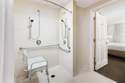 a bathroom with a walk in shower and a sink at Residence Inn by Marriott Saddle River in Saddle River