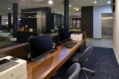 an office with a desk with two computers on it at Courtyard by Marriott Harrisburg Hershey in Harrisburg