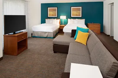 a living room with a couch and a tv at Residence Inn by Marriott Harrisburg Hershey in Harrisburg