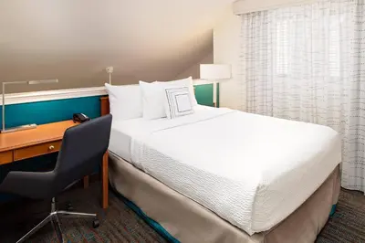 a hotel room with a bed and a desk and a bed at Residence Inn by Marriott Harrisburg Hershey in Harrisburg