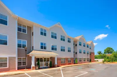 a row of apartment buildings with a parking lot at Residence Inn by Marriott Harrisburg Hershey in Harrisburg