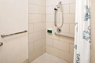 a bathroom with a shower with a shower curtain at Residence Inn by Marriott Harrisburg Hershey in Harrisburg