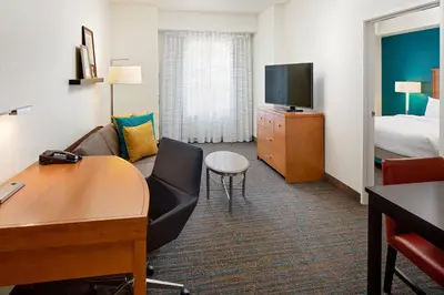 a hotel room with a bed and a desk and a room at Residence Inn by Marriott Harrisburg Hershey in Harrisburg
