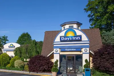 a day inn sign on the front of a building at Days Inn by Wyndham Nanuet / Spring Valley in Nanuet