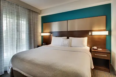 a hotel room with a large bed and a window at Residence Inn by Marriott Philadelphia Valley Forge/Collegeville in Collegeville