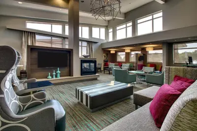 a large living room with a fireplace and a tv at Residence Inn by Marriott Philadelphia Valley Forge/Collegeville in Collegeville
