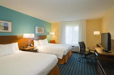 a hotel room with two beds and a television at Best Western Allentown Bethlehem Lehigh Valley Inn & Suites in Bethlehem