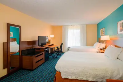 a hotel room with two beds and a television at Best Western Allentown Bethlehem Lehigh Valley Inn & Suites in Bethlehem