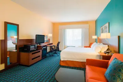 a hotel room with a bed and a desk with a television at Best Western Allentown Bethlehem Lehigh Valley Inn & Suites in Bethlehem