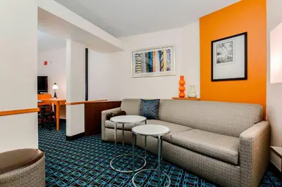 a living room with a couch and two tables at Fairfield by Marriott Wilkes-Barre in Wilkes-Barre