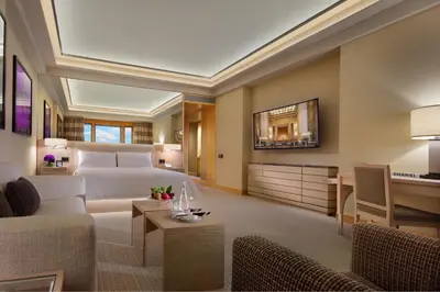 a hotel room with a bed and a desk at Four Seasons Hotel New York in New York