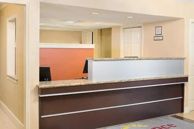 an office with a reception desk with a computer at Residence Inn Binghamton in Vestal