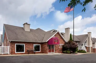 a restaurant with an american flag in front of it at Residence Inn Binghamton in Vestal