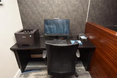 a desk with a computer monitor and a printer at Fairfield Inn by Marriot Binghamton in Binghamton