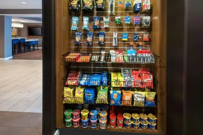 a refrigerator filled with lots of different types of food at Courtyard Binghamton in Vestal