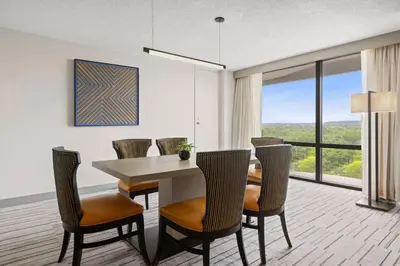 a dining room with a table and chairs at Marriott Saddle Brook in Saddle Brook