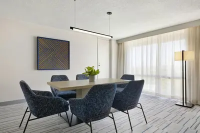 a dining room with a table and chairs at Marriott Saddle Brook in Saddle Brook