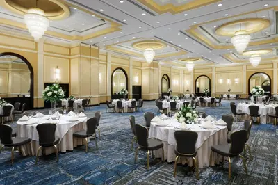 a banquet hall with white tables and chairs at Delta Hotels by Marriott Woodbridge in Iselin