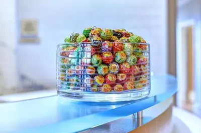 a large glass container filled with candy on a table at SpringHill Suites Harrisburg Hershey in Harrisburg