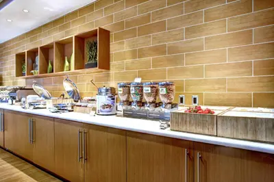 a kitchen with a counter with food on it at SpringHill Suites Harrisburg Hershey in Harrisburg