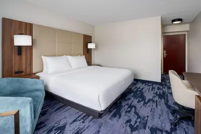 a bedroom with a large white bed and a desk at Fairfield Inn Harrisburg Hershey in Harrisburg