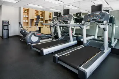a gym with treadmills and elliptical machines at Fairfield Inn Harrisburg Hershey in Harrisburg
