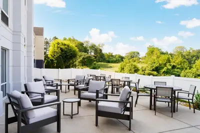 a row of tables and chairs on a patio at Fairfield Inn Harrisburg Hershey in Harrisburg