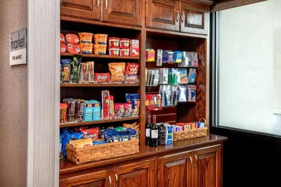 a book shelf filled with food and drinks at SpringHill Suites by Marriott Hershey Near The Park in Hershey