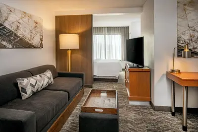 a living room with a couch and a television at SpringHill Suites by Marriott Hershey Near The Park in Hershey