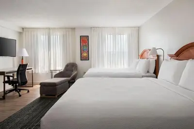 a hotel room with two beds and a desk at TownePlace Suites Wilmington Newark / Christiana in Newark