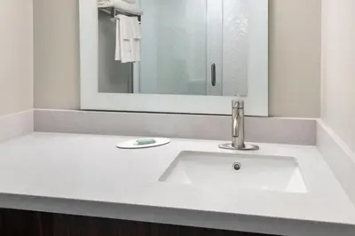 a bathroom with a sink and a mirror at TownePlace Suites Wilmington Newark / Christiana in Newark