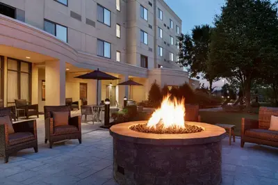 a fire pit in the courtyard of a hotel at Courtyard Lancaster in Lancaster