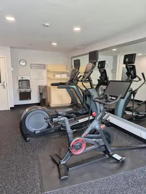 a gym with several exercise bikes in a room at Spark by Hilton Lancaster in Lancaster