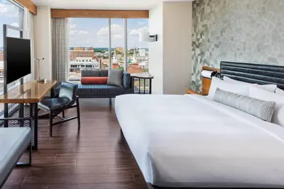 a hotel room with a bed and a desk at Lancaster Marriott at Penn Square in Lancaster
