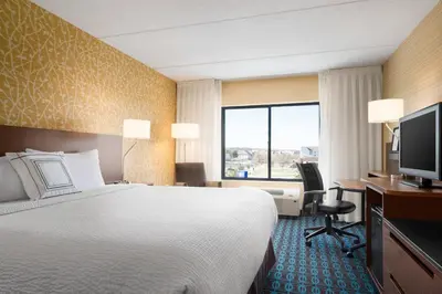 a hotel room with a bed and a desk and a television at Fairfield Inn by Marriott Philadelphia West Chester/Exton in Exton