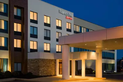 an exterior view of a hospital building at night at Fairfield Inn by Marriott Philadelphia West Chester/Exton in Exton