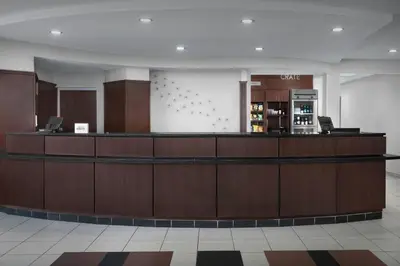 a lobby of a hotel with a reception counter at Courtyard Philadelphia Great Valley/Malvern in Malvern